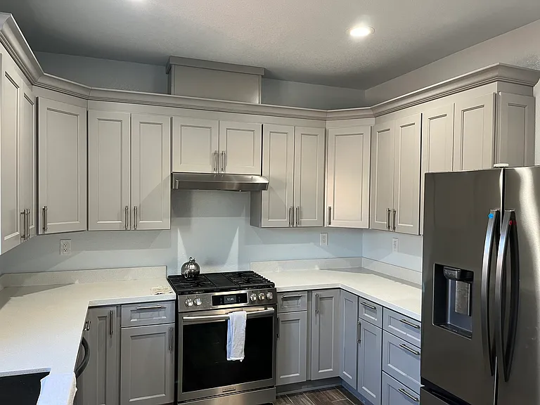 Spacious kitchen with stove/oven, sink, refrigerator, dishwasher and plenty of cabinet/pantry space.