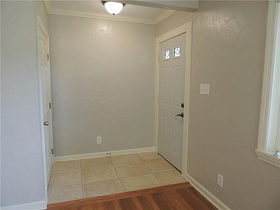 The ceramic tiled floor of the front entry way greets your guests as does the roomy coat closet.