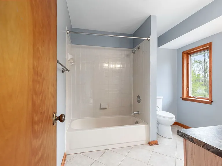 Primary bath has is generously sized and offers an abundance of natural light