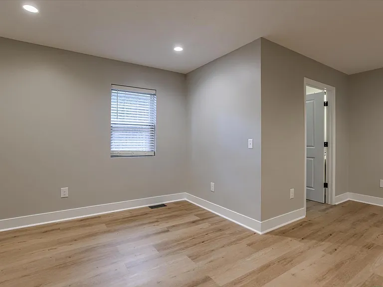 Dining/nook area facing main floor bathroom/laundry.