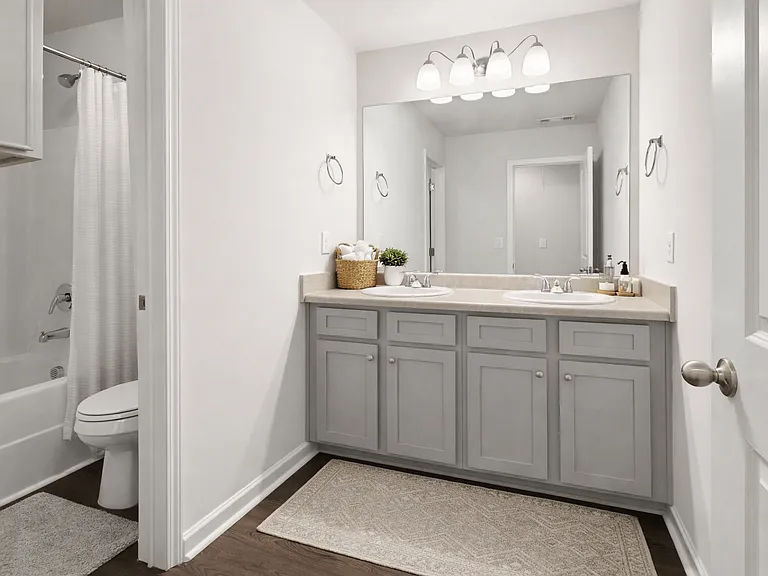 Secondary suite bathroom with a tub and shower combination