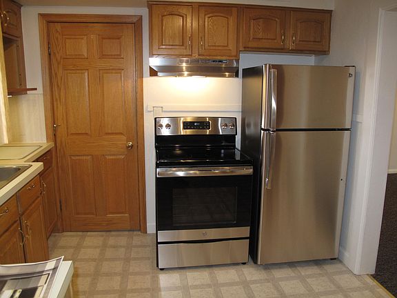 Stainless electric range and refrigerator