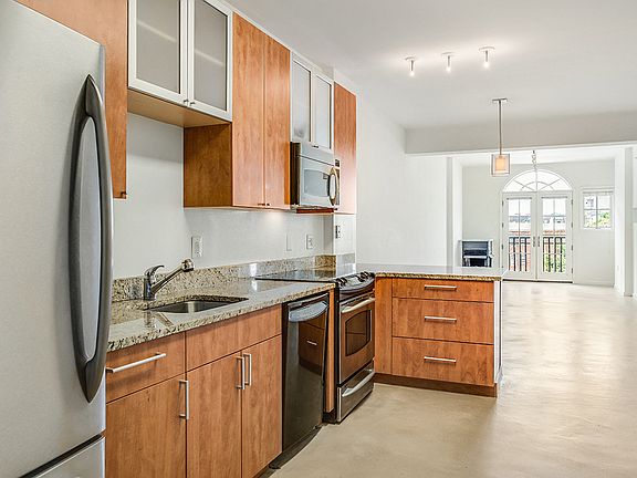 Renovated kitchen with granite countertops and stainless steel appliances