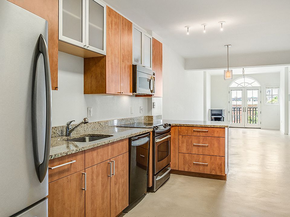 Renovated kitchen with granite countertops and stainless steel appliances
