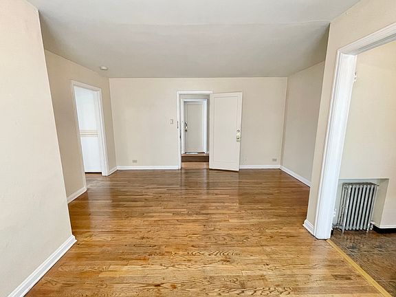 Bright and spacious living area with elegant hardwood floors and neutral walls, perfect for a cozy home setup. Bright and spacious living area with elegant hardwood floors and neutral walls, perfect for a cozy home setup.