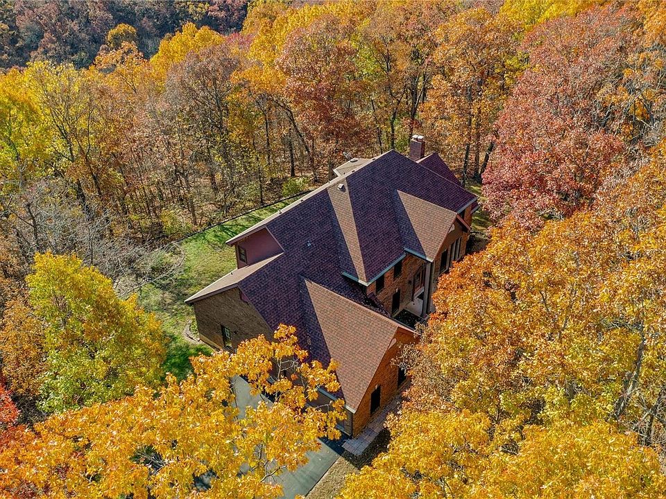 STUNNING ALL BRICK home on 13 acres in ROCKWOOD SCHOOL DISTRICT!