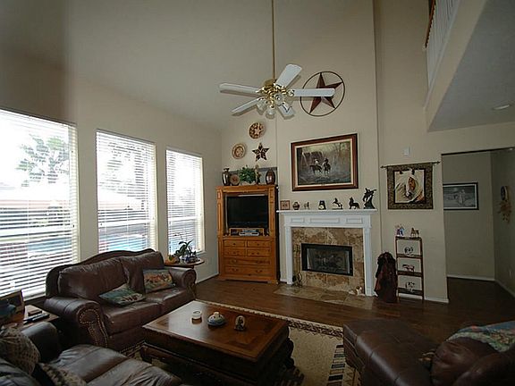 THE HIGH CEILING MAKES THE LIVING ROOM FEEL EVEN LARGER