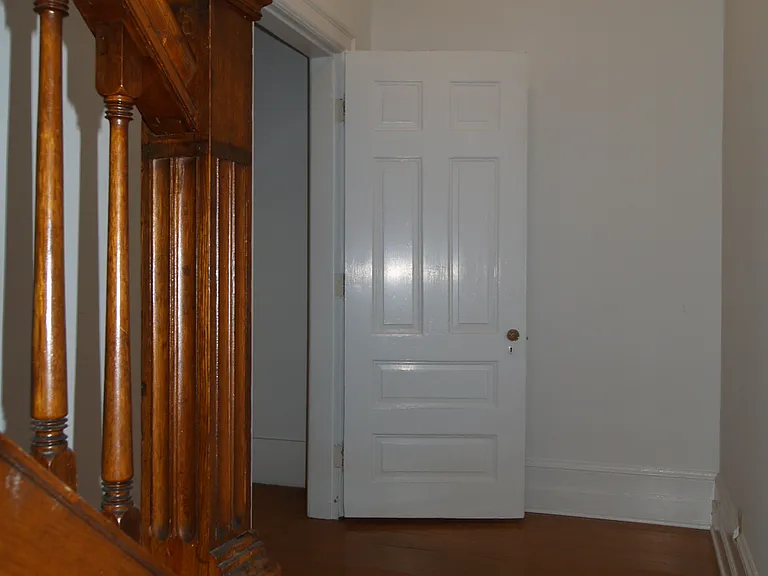 Second floor landing with coat closet