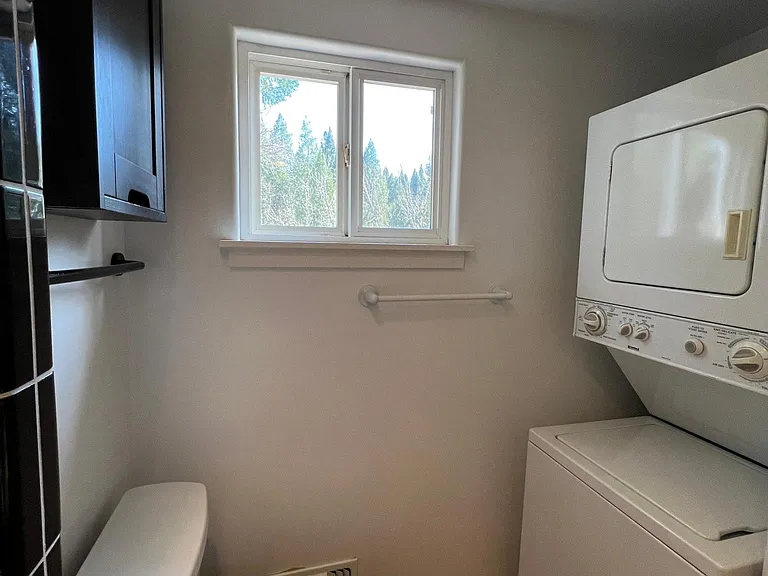 Bathroom ensuite bedroom 1 with washer and dryer