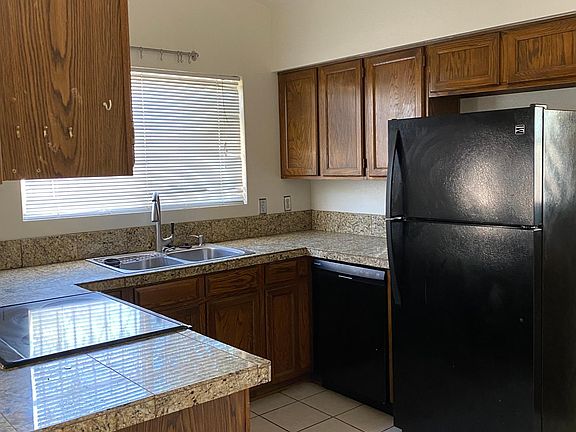 Kitchen with granite counter tops.