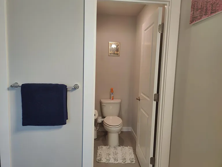 Attached toilet in master bathroom