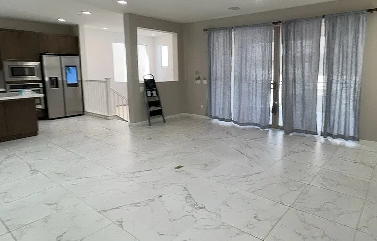 2nd floor - Great room - Kitchen, living room, under-stair storage, bathroom, balcony/patio
