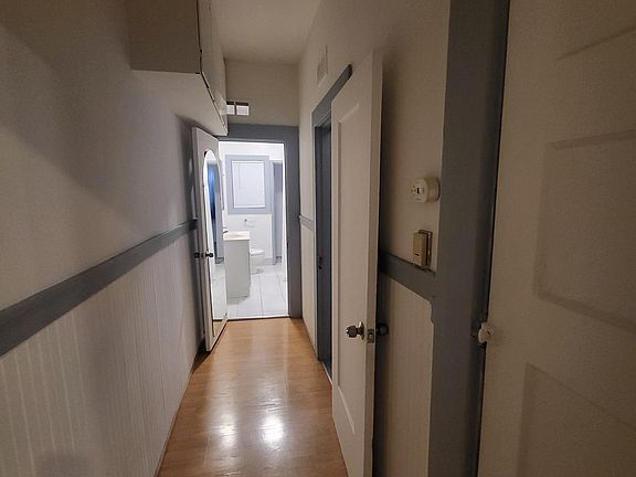 Hallway leading to bathroom and bedroom