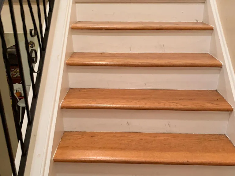 Steps going upstair to Bedrooms and Laundry Room ( upstairs bathroom can be seem)