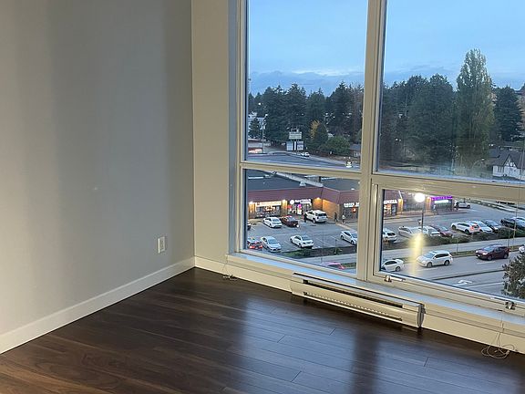 Spacious master bedroom with a private attached bathroom (ensuite) featuring a shower, modern vanity, and ample storage.