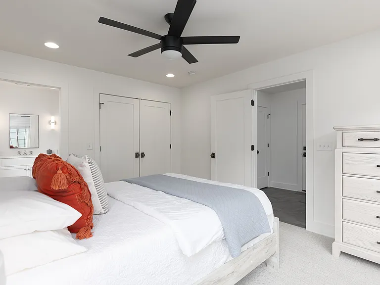 Bedroom 2 with a king bed and ensuite bath. Located on the 1st floor. Tastefully decorated with high-end modern furnishings and thoughtful touches to make your stay as comfortable as possible.