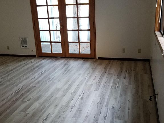 Living room looking from stairs to patio