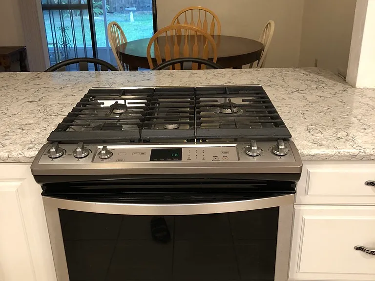 5 burner gas stove, view towards screened in porch