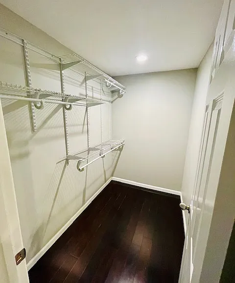 Primary bedroom has vaulted ceilings and walk-in closet