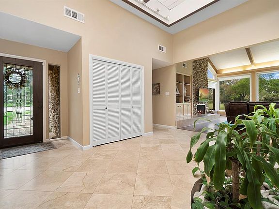 Lovely entry with leaded glass door and updated custom skylights offer wonderful natural light to this beautiful space.