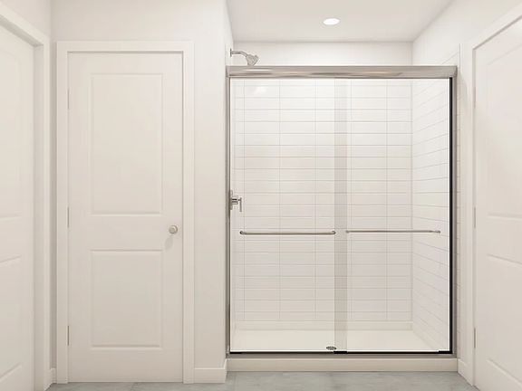 Primary bath with glass shower enclosure