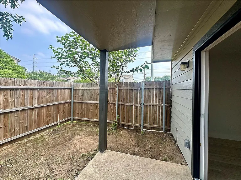 Private fenced covered patio space.