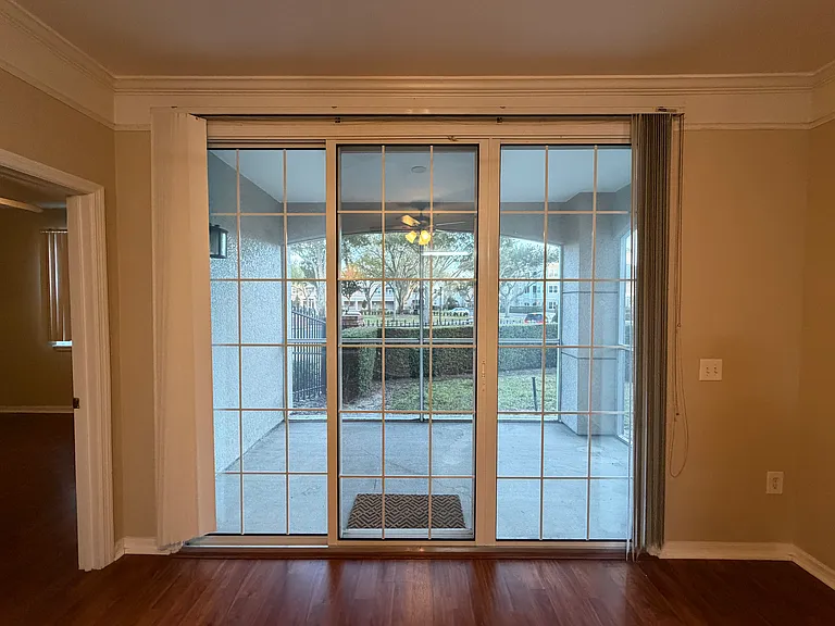 Patio view from living room. Private screened patio ideal for relaxing and enjoying fresh air.