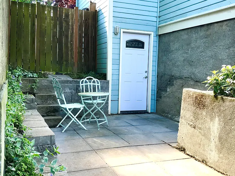 Sun-filled private patio for BBQing and hanging outside.