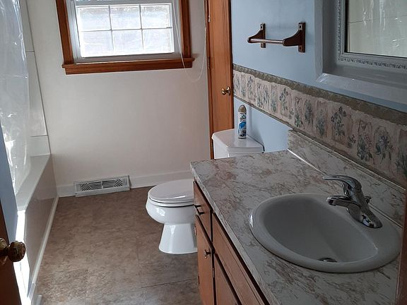 Full Bath in Hall, Tub with Shower.