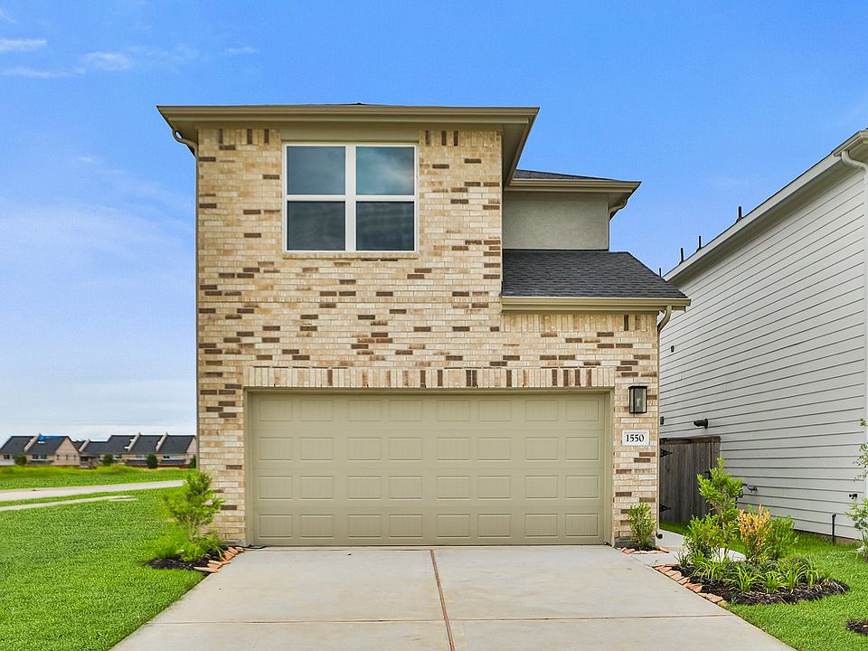 Discover refined elegance with a striking white brick facade and manicured landscaping in Lexington