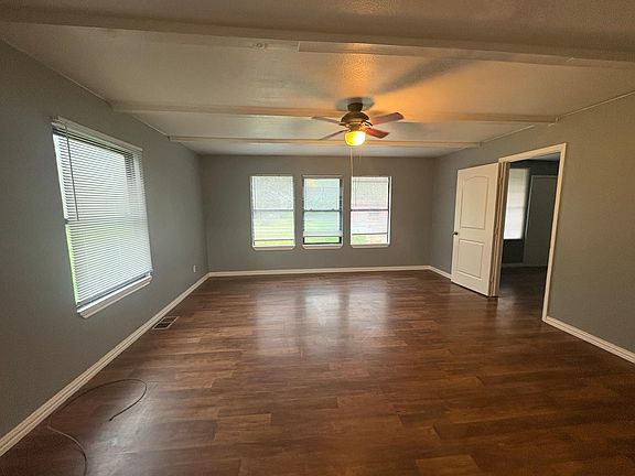 Formal living room next to master bedroom and kitchen.