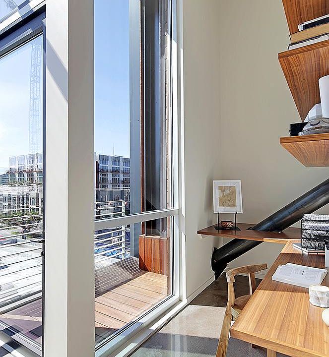 The private balcony sits on the northwest corner of the loft, next to the built-in office.