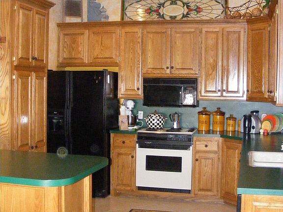 Kitchen with wonderful storage!! Breakfast bar built in.
