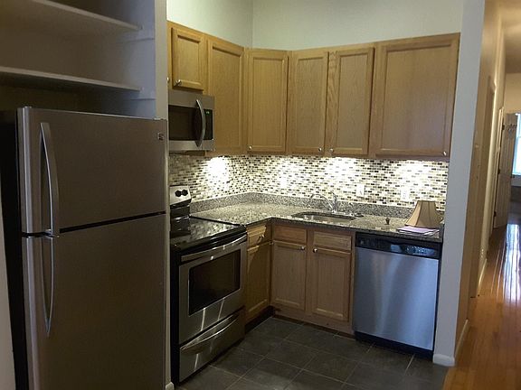 Kitchen will all stainless steel appliances and under-counter lighting. Includes a Dishwasher and microwave.