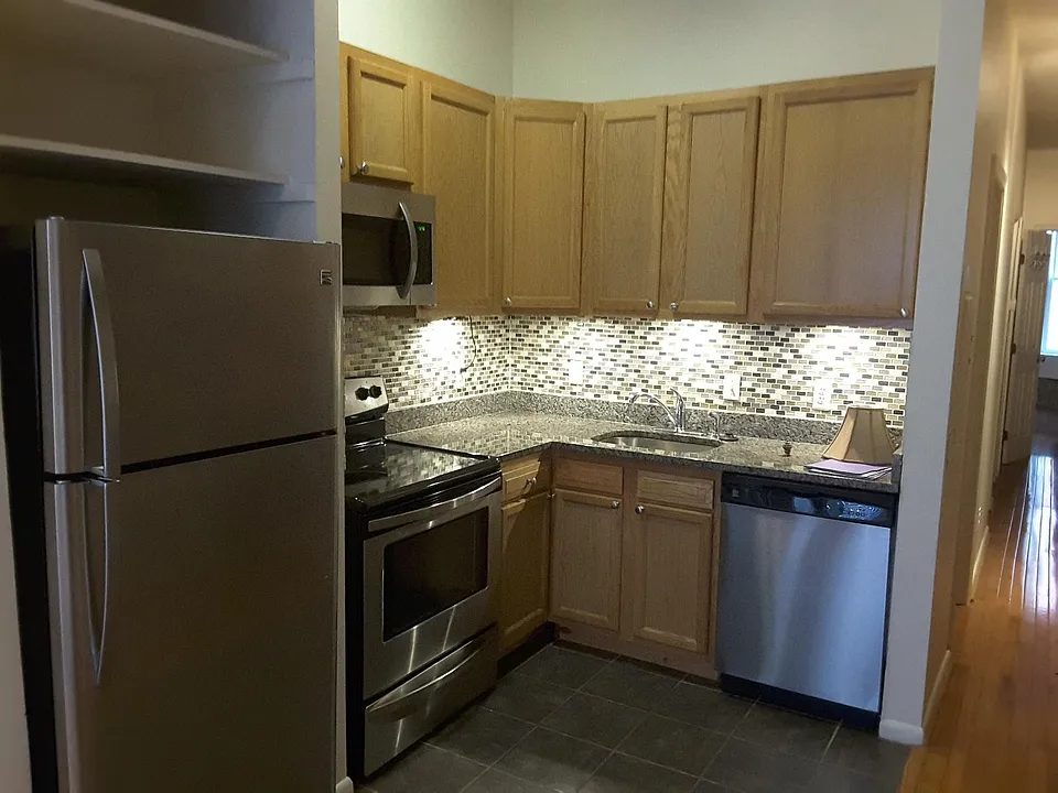 Kitchen will all stainless steel appliances and under-counter lighting. Includes a Dishwasher and microwave.