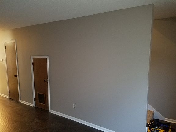roomy living room with hand scraped laminate flooring