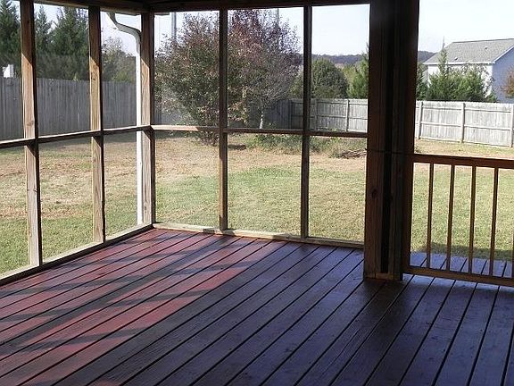 Screened in porch overlooks huge backyard