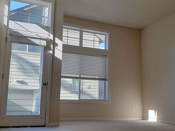 Spacious Living Room with High Ceilings and Lots of Light
