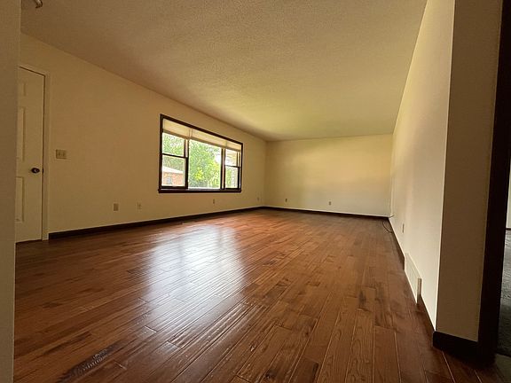Hardwood hickory flooring in oversized living room