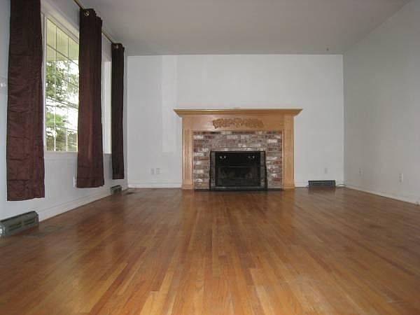 Hardwood floors and wood burning fireplace