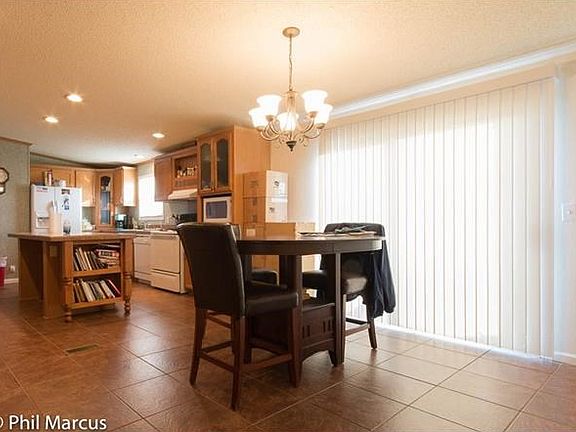 Kitchen and dining room combination with a sliding glass door that goes out to the porch.