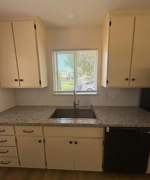 Beautiful kitchen with brand new sink and countertops.