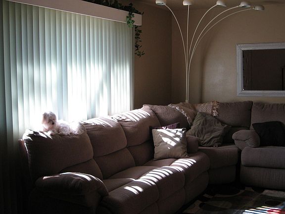 Living room has refinished hardwood flrs updated trim and custom window casing