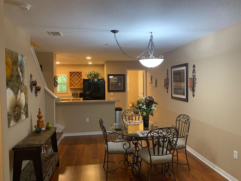 Modern kitchen seamlessly flows into a charming dining area with a convenient powder room_making entertaining a breeze.