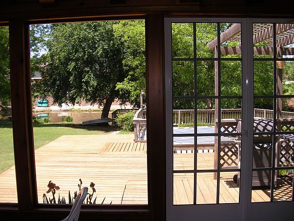 Enjoy the yard without the bugs in this screened-in porch.