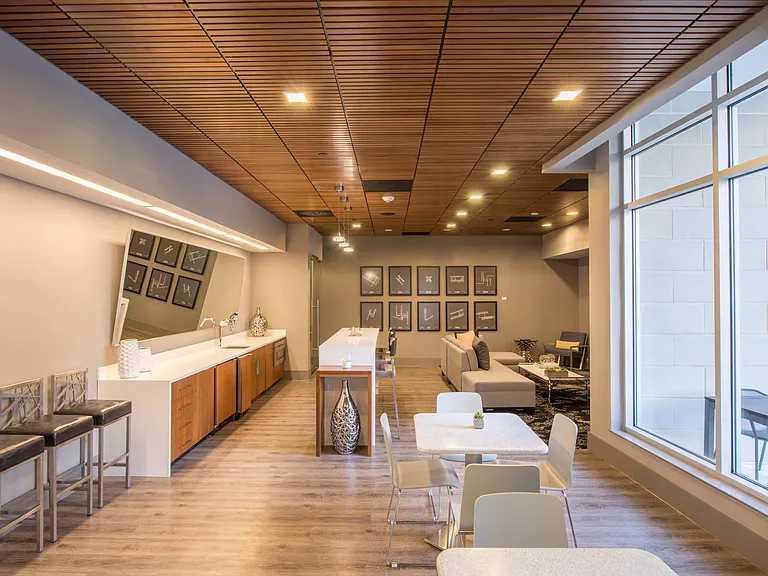 Stylish Clubroom with Kitchen, Social Seating Areas, and Work from Home Spaces