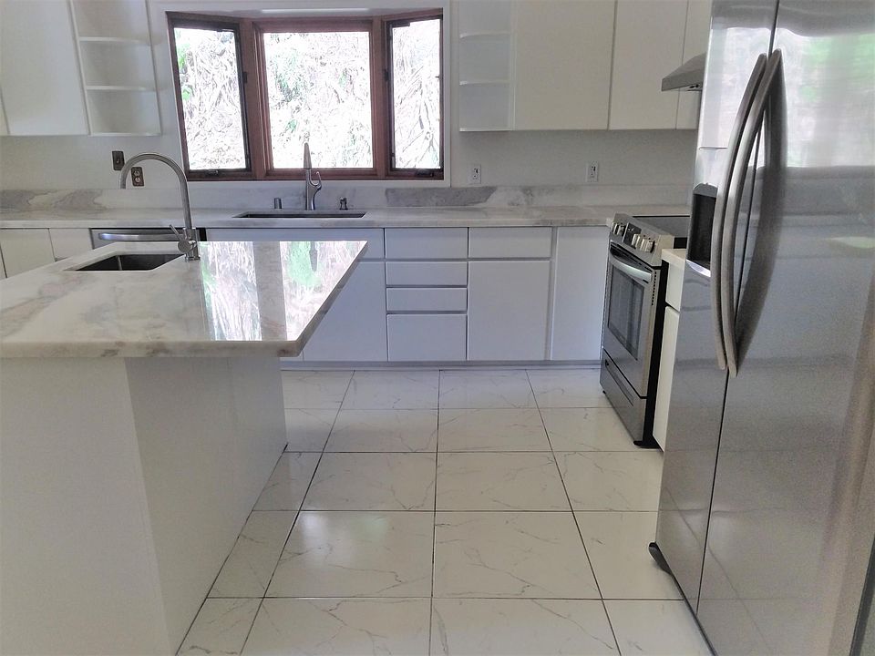 Brand new kitchen remodel - marble counter-tops, ceramic tile floor, all new sinks and appliances, and refinished cabinets.