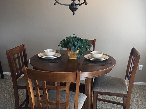 Counter high table and 4 chairs. Table also has a leaf.