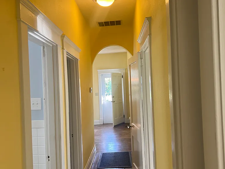 Looking down hallway from back two bedrooms/bathroom to front door