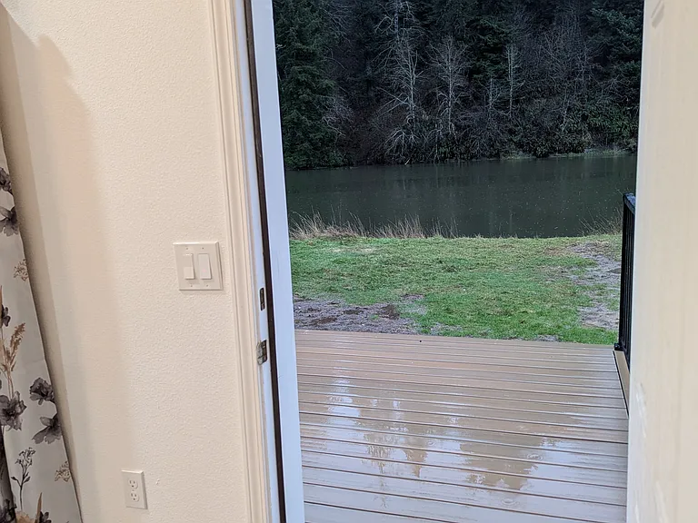Back door in master leads to your 12x22' composite deck for plenty of relaxing on your private river access.